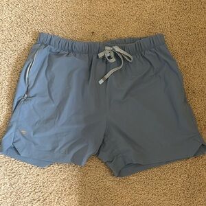 Men’s Fabletics: One short. 5 inch inseam. Light blue color.